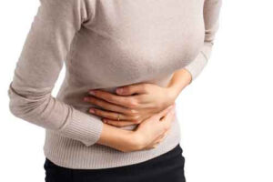Woman holding her stomach Woman holding her stomach