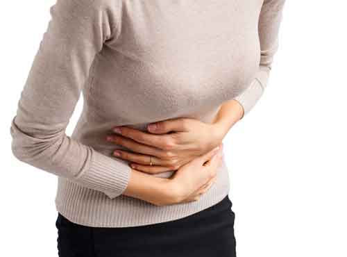 Woman holding her stomach Woman holding her stomach