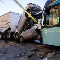 A professional negligence lawyer gathers evidence at a public transit accident scene in New York A professional negligence lawyer gathers evidence at a public transit accident scene in New York