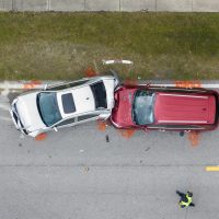Car crash with two vehicles collided at traffic accident site on American street Car crash with two vehicles collided at traffic accident site on American street